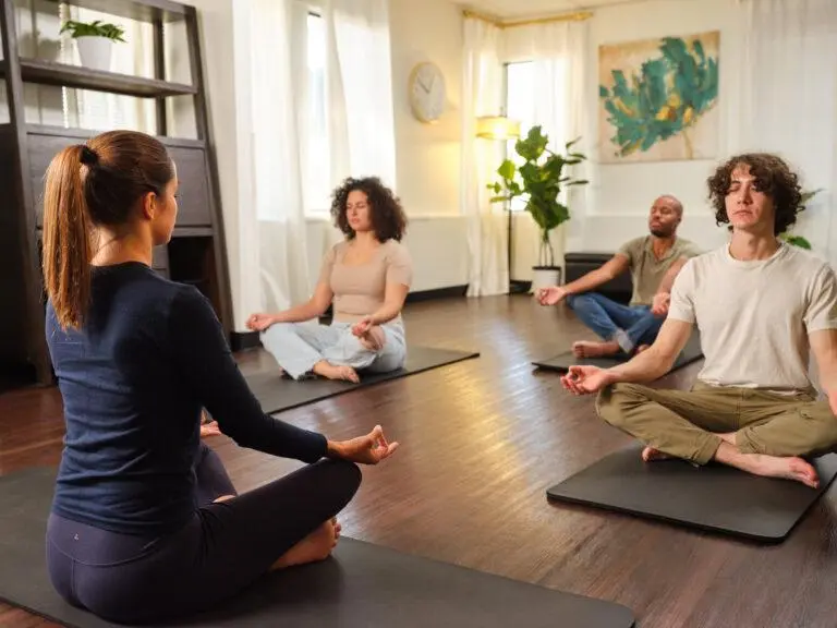 Instructor leading a live guided group meditation session