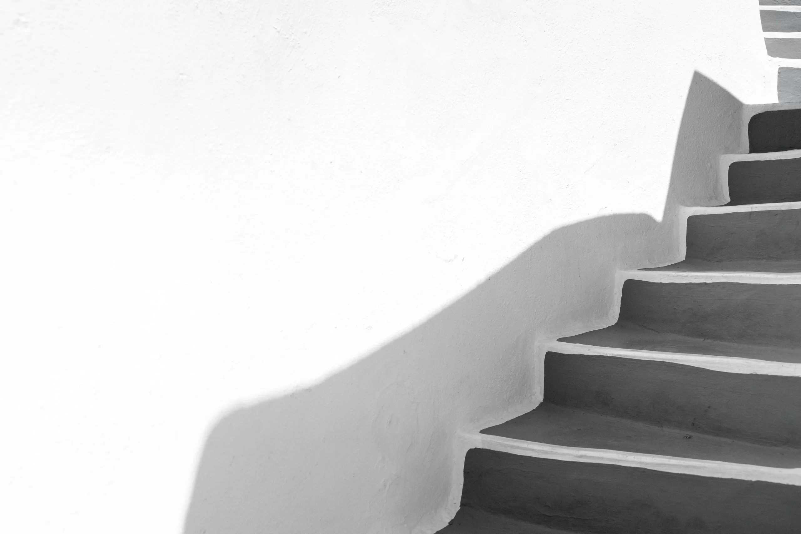 Sunlit white staircase representing the step-by-step subtraction meditation method